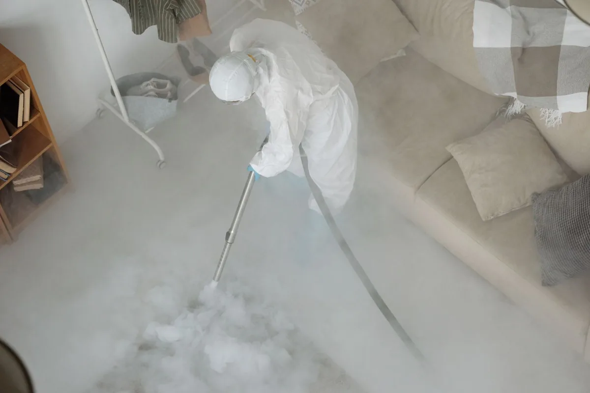 Biohazard cleanup technician in protective equipment, Logan, UT